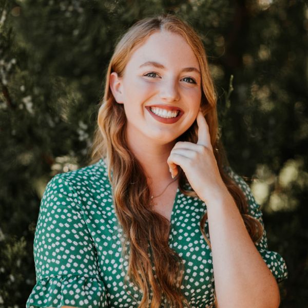 Close up of young woman receiving massage on shoulders in a clinical center. Medicine, healthcare and beauty concept.